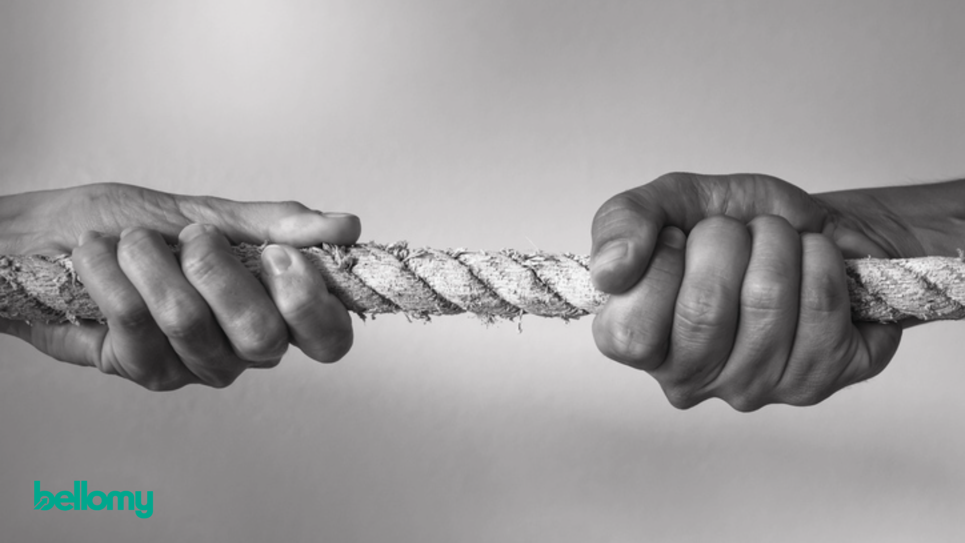 Hands pull opposite ends of a rope, representing the competing trade-offs consumers make when choosing a brand