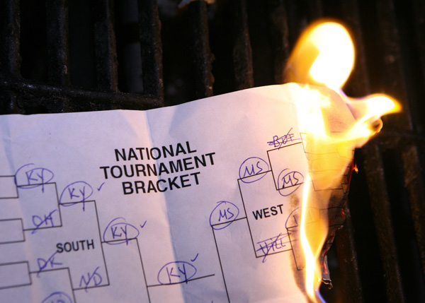 NCAA basketball bracket on fire.