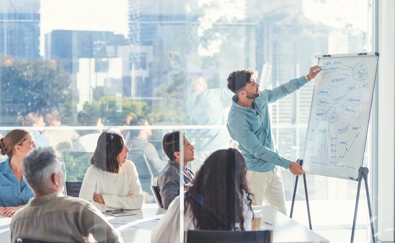 Business people watching a presentation on the whiteboard