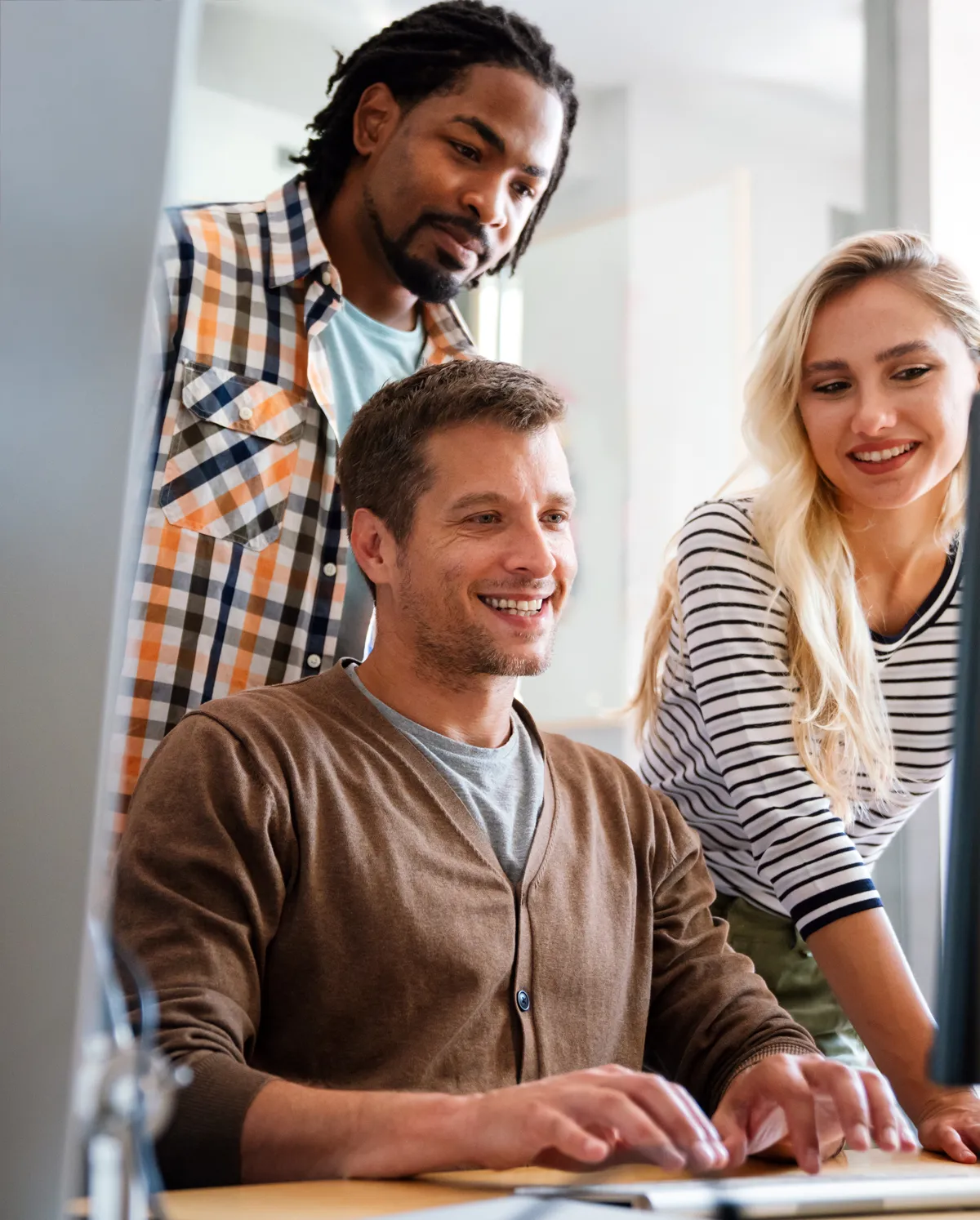 Group of successful happy multiethnic business people working as a team in office