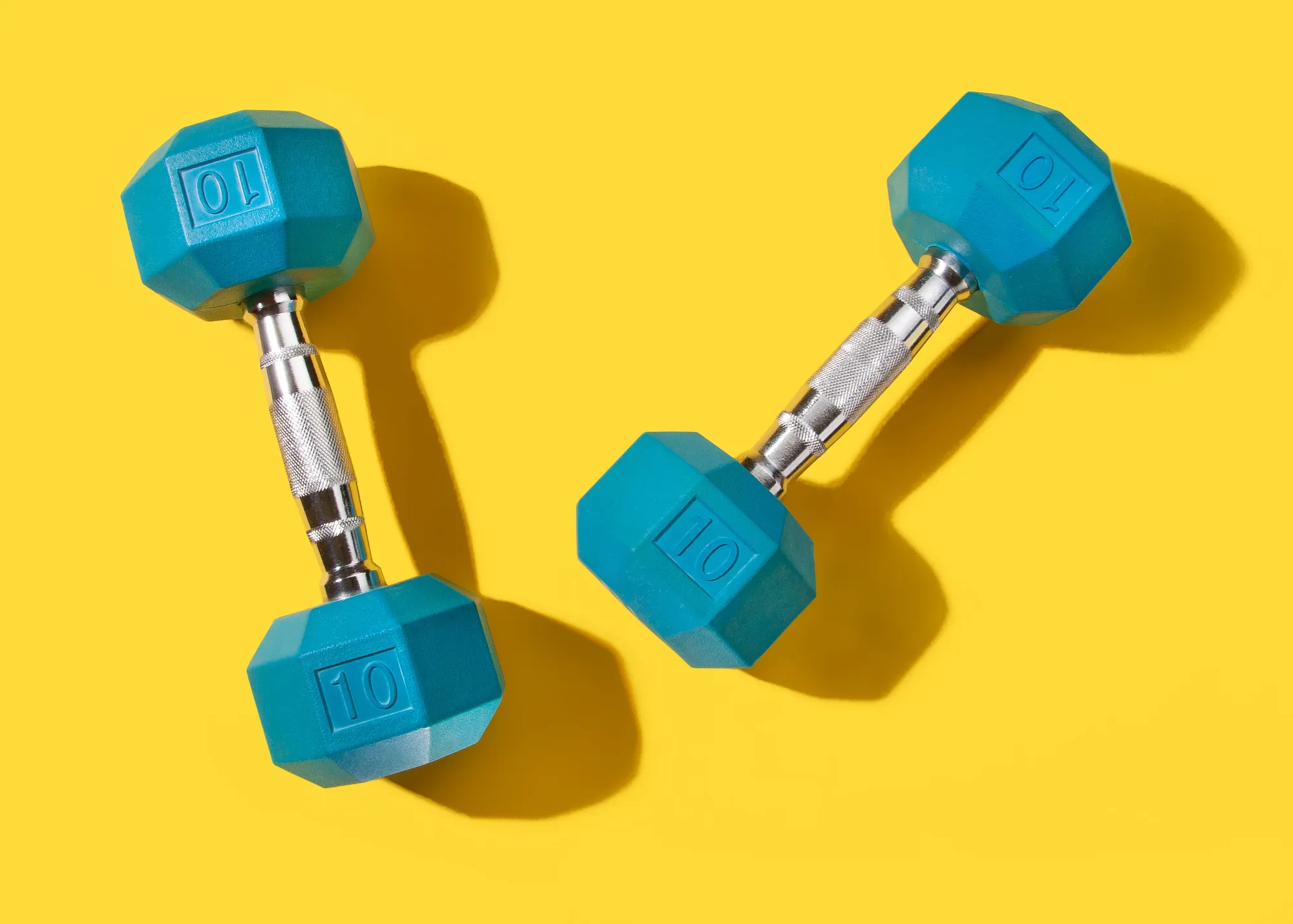 Blue Hand Weights on Yellow background