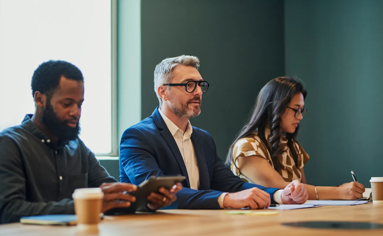 Diverse business professionals in a meeting discussing ideas and strategies