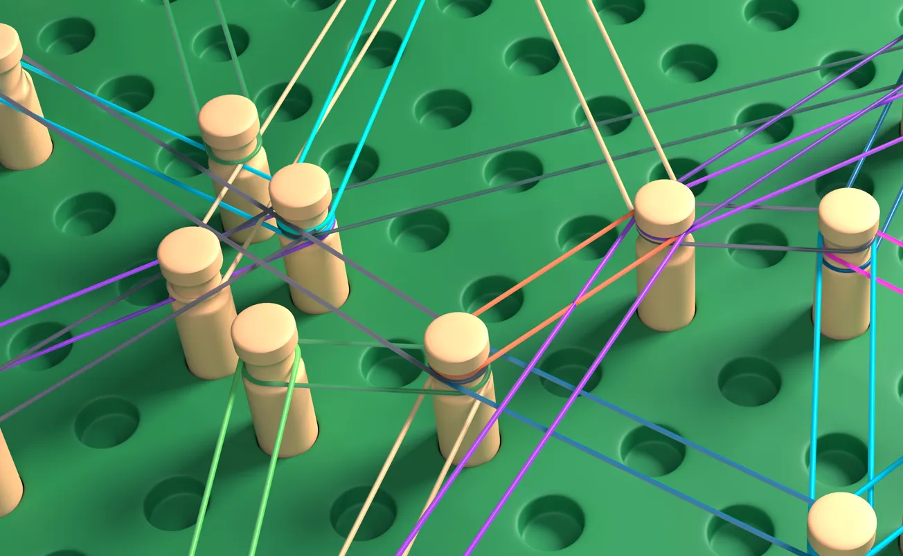 Wooden rods are inserted into a board with holes and connected with multi-colored threads