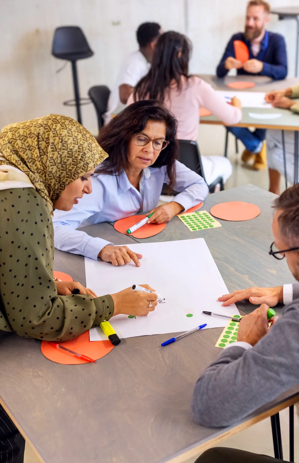 Diverse group of business professionals participating in seminar activities