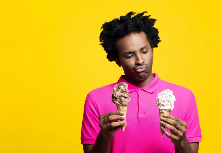 Man choosing between two ice cream flavors